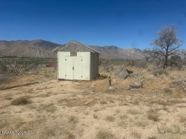0 Pinon Place Coleville, CA 96107 - Photo 26 of 27 a view of a dry yard with mountain