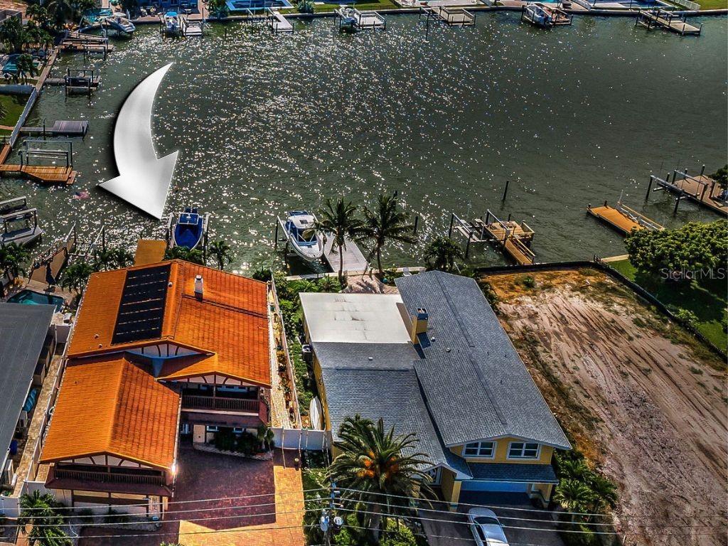 an aerial view of a house with a swimming pool