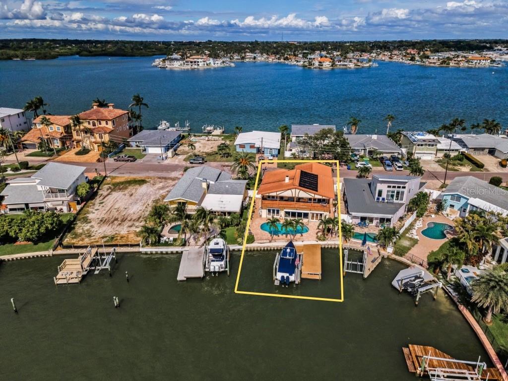 16108 6th Street East Redington Beach, FL 33708 - Photo 12 of 60 an aerial view of a house with a lake view