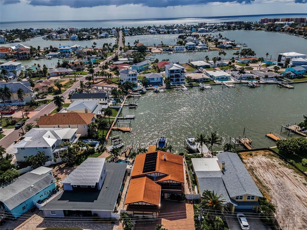 16108 6th Street East Redington Beach, FL 33708 - Photo 15 of 60 an aerial view of a houses with a lake view