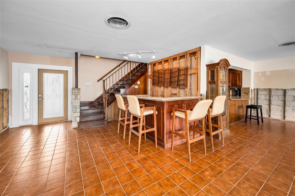 16108 6th Street East Redington Beach, FL 33708 - Photo 19 of 60 a dining room with furniture and wooden floor