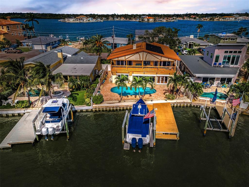16108 6th Street East Redington Beach, FL 33708 - Photo 3 of 60 an aerial view of houses with outdoor space