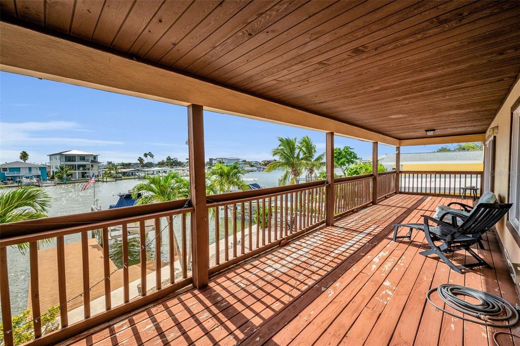 16108 6th Street East Redington Beach, FL 33708 - Photo 34 of 60 a view of balcony with wooden floor