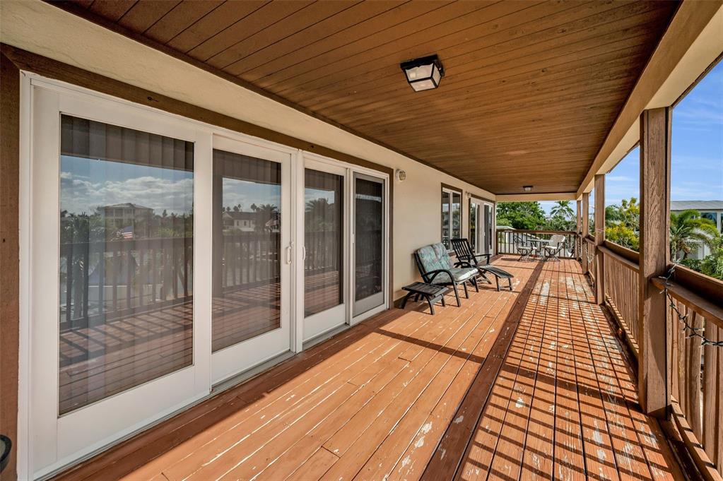 16108 6th Street East Redington Beach, FL 33708 - Photo 36 of 60 a view of a patio with dining table and chairs
