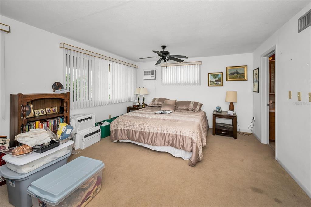 16108 6th Street East Redington Beach, FL 33708 - Photo 39 of 60 a bedroom with a bed and a dresser