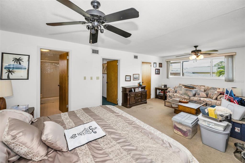 16108 6th Street East Redington Beach, FL 33708 - Photo 40 of 60 a bedroom with furniture and a ceiling fan