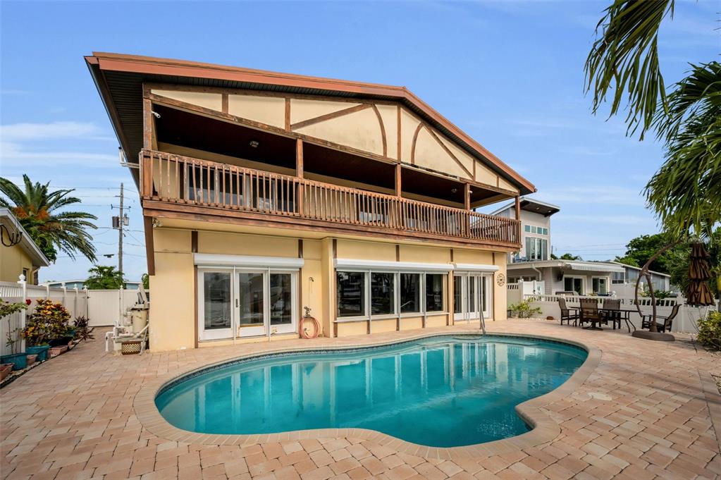 16108 6th Street East Redington Beach, FL 33708 - Photo 49 of 60 a front view of a house with swimming pool
