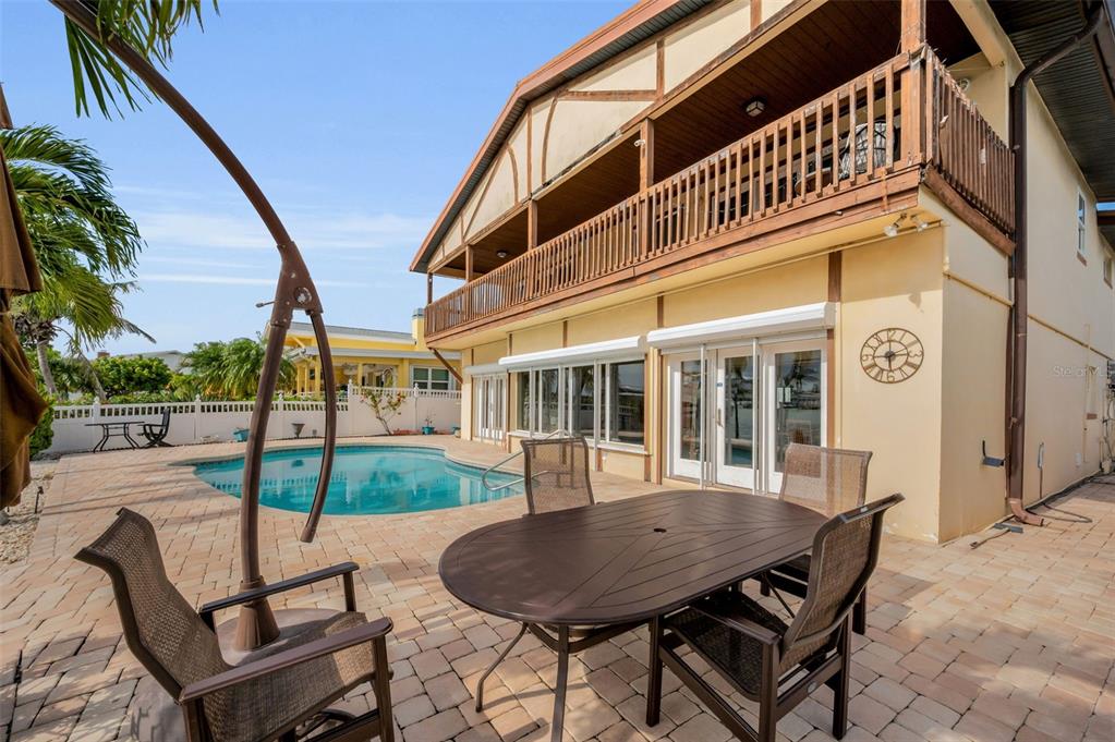 16108 6th Street East Redington Beach, FL 33708 - Photo 51 of 60 a view of a house with backyard and sitting area