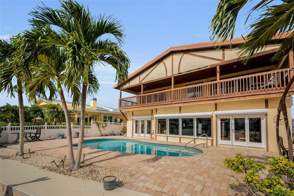 16108 6th Street East Redington Beach, FL 33708 - Photo 53 of 60 a front view of a house with a tree