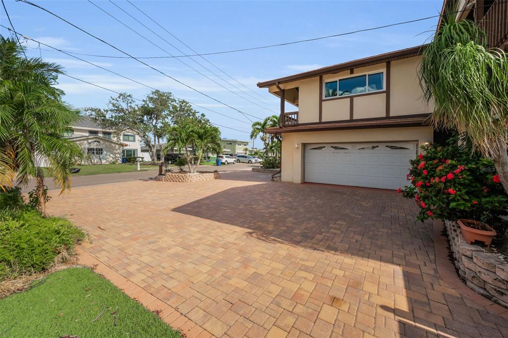 16108 6th Street East Redington Beach, FL 33708 - Photo 59 of 60 a view of a house with a yard and potted plants