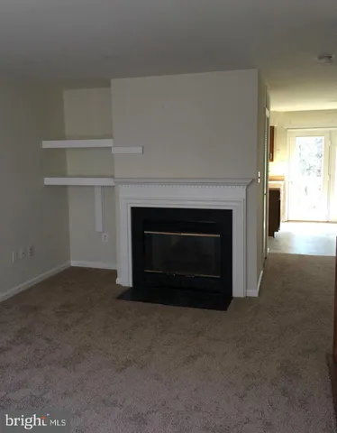 a living room with a fireplace