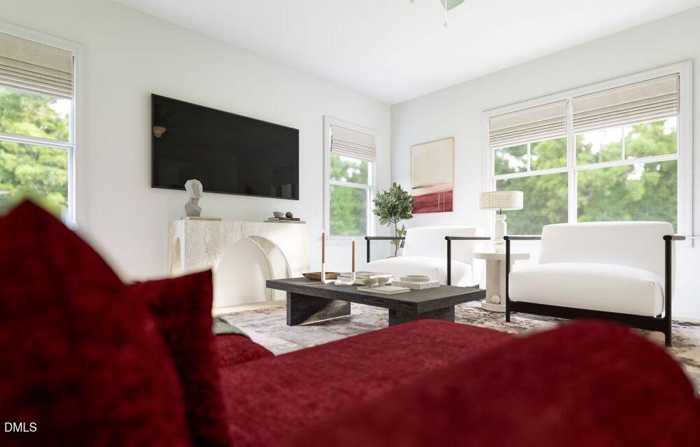 713 Bolera Road Knightdale, NC 27545 - Photo 12 of 35 a living room with furniture and a flat screen tv