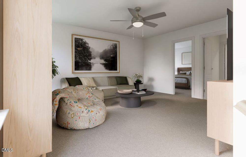 713 Bolera Road Knightdale, NC 27545 - Photo 15 of 35 a living room with furniture and ceiling fan
