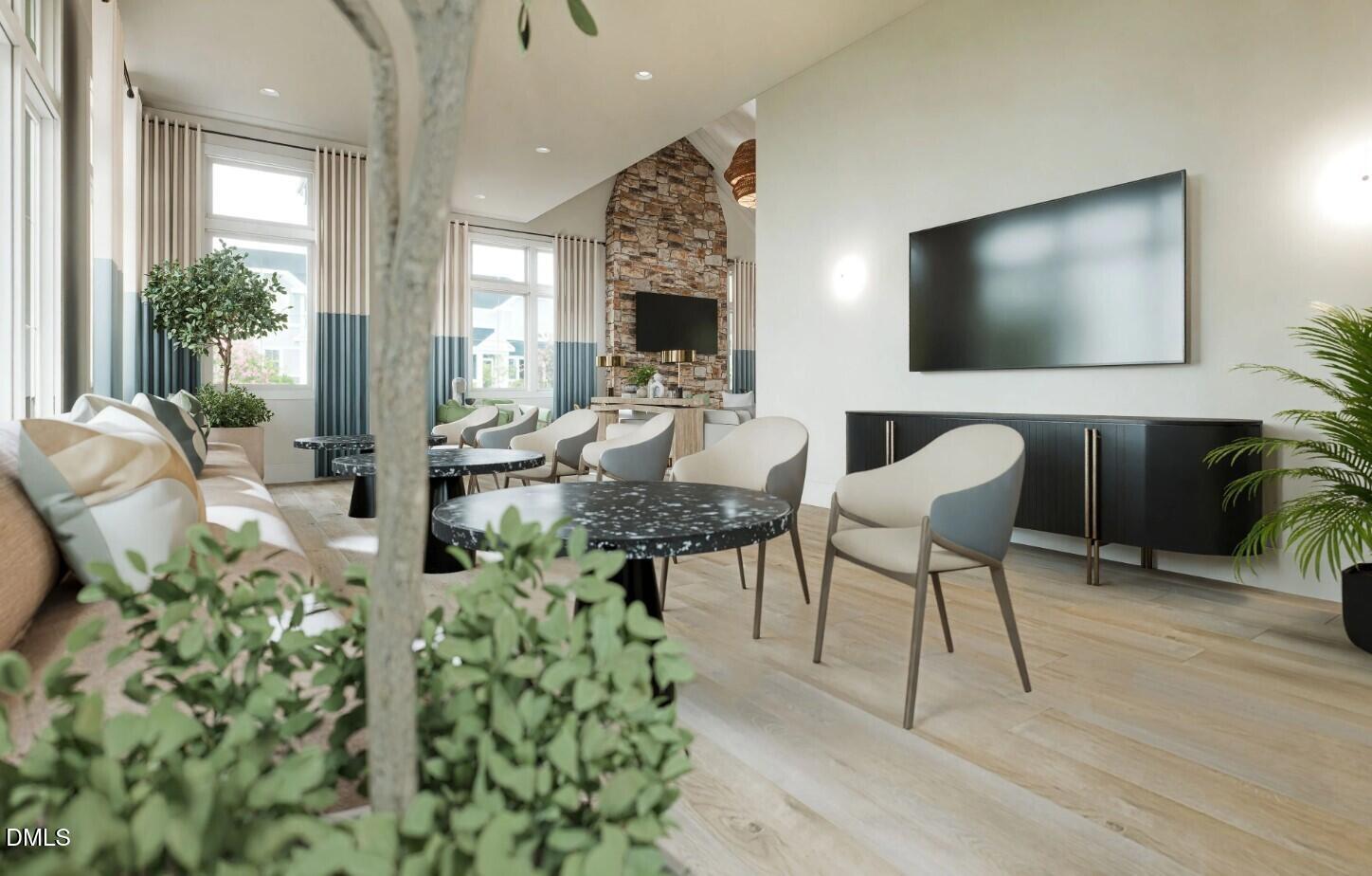 713 Bolera Road Knightdale, NC 27545 - Photo 30 of 35 a living room with furniture and a flat screen tv