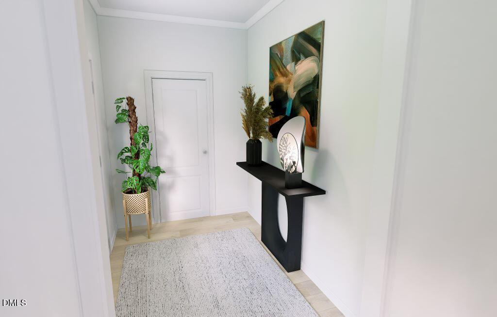713 Bolera Road Knightdale, NC 27545 - Photo 7 of 35 a view of a hallway with wooden floor and a potted plant