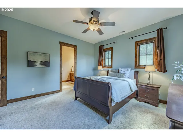 a spacious bedroom with a bed and window