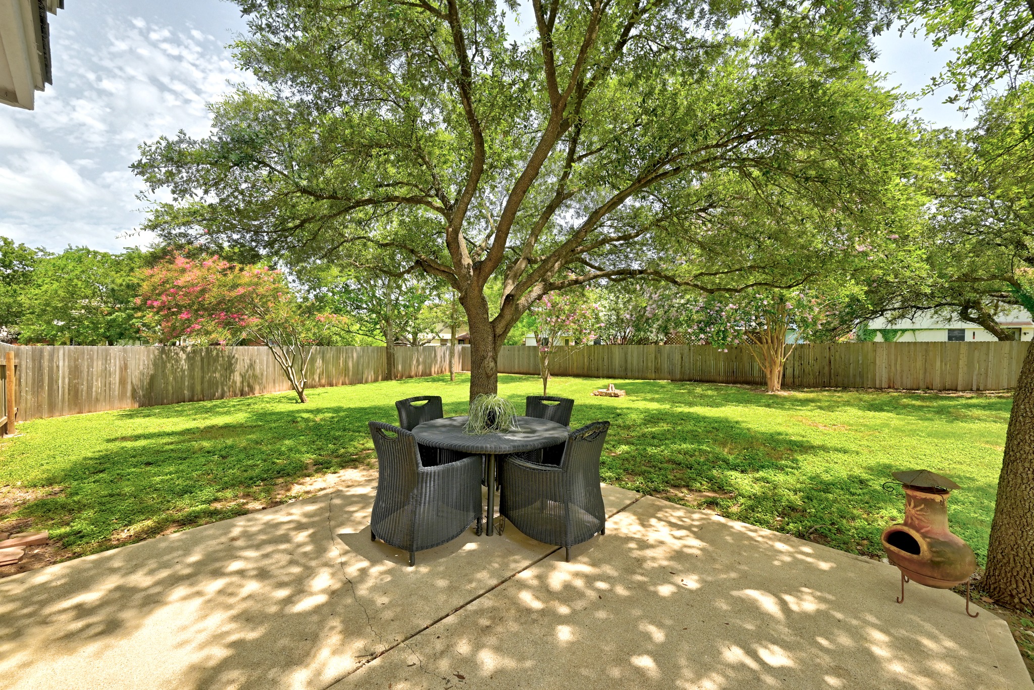1801 Monks Tale Court Austin, TX 78748 - Photo 30 of 36 A private, shaded patio offers serene outdoor living in this fenced yard.