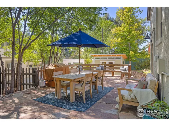 a view of a backyard with sitting area