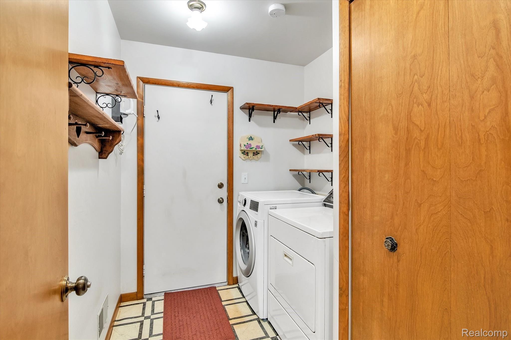 10419 Maple Road Hartland, MI 48353 - Photo 25 of 37 Laundry room with access to the oversized two car garage