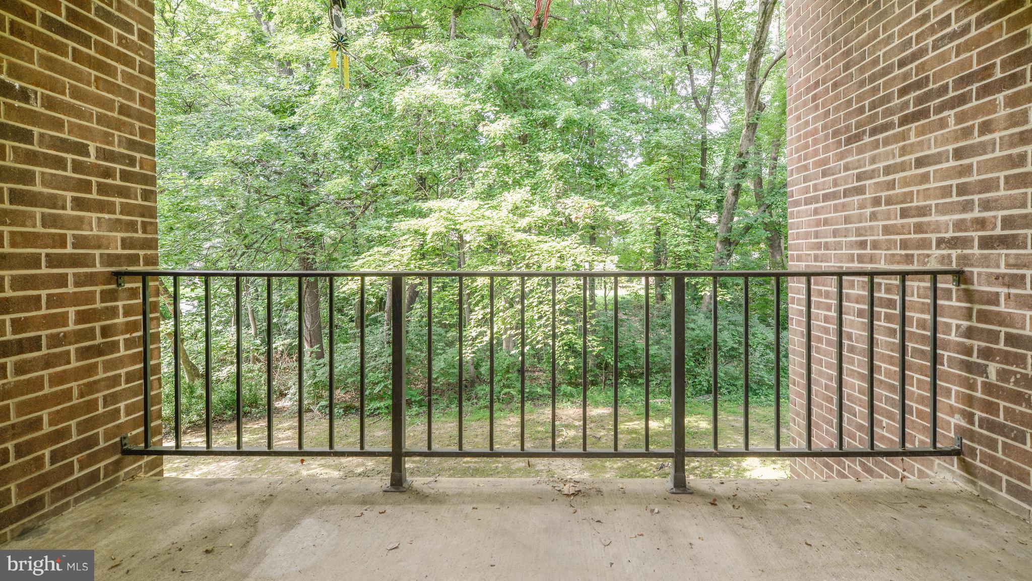 1414 Northgate Square, Unit 12B Reston, VA 20190 - Photo 23 of 30 Patio with view of woods