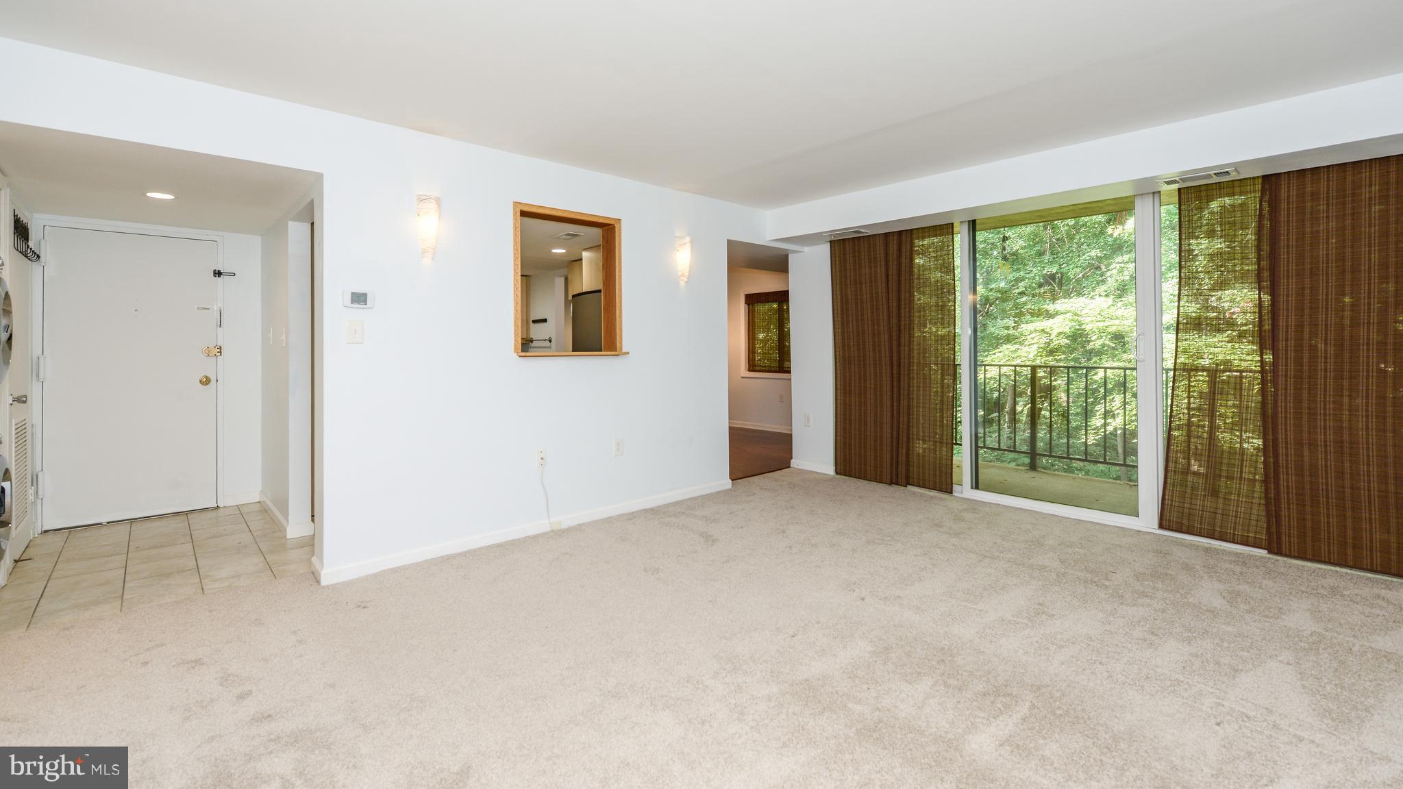 1414 Northgate Square, Unit 12B Reston, VA 20190 - Photo 9 of 30 Living Room with Sliding Glass Doors to Balcony