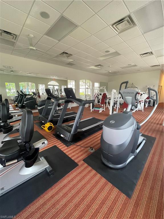 7168 Lemuria Circle, Unit 1701 Naples, FL 34109 - Photo 36 of 39 Gym with a paneled ceiling