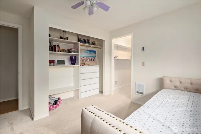 a room with a bed and a window