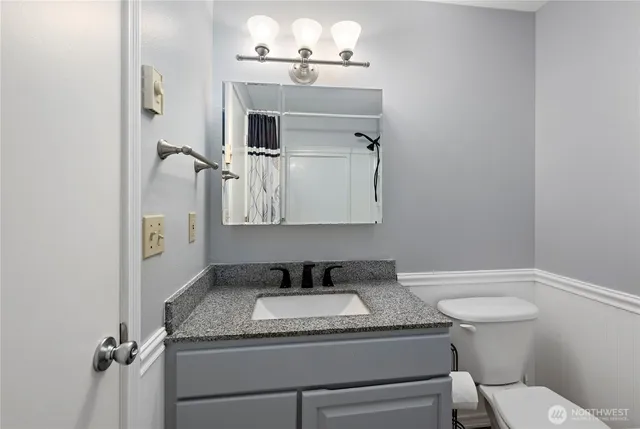 a bedroom with a bed and dresser