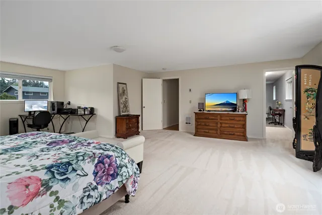 a bedroom with a bed and a couch