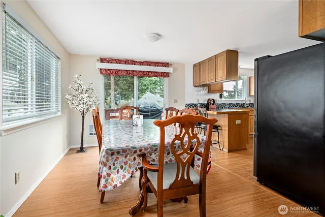 a view of a dining room with furniture and wooden floor