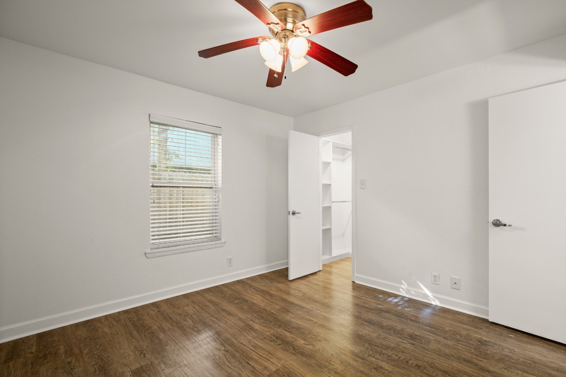 2020 South Congress Avenue, Unit 2102 Austin, TX 78704 - Photo 11 of 22 a view of an empty room with wooden floor and a window