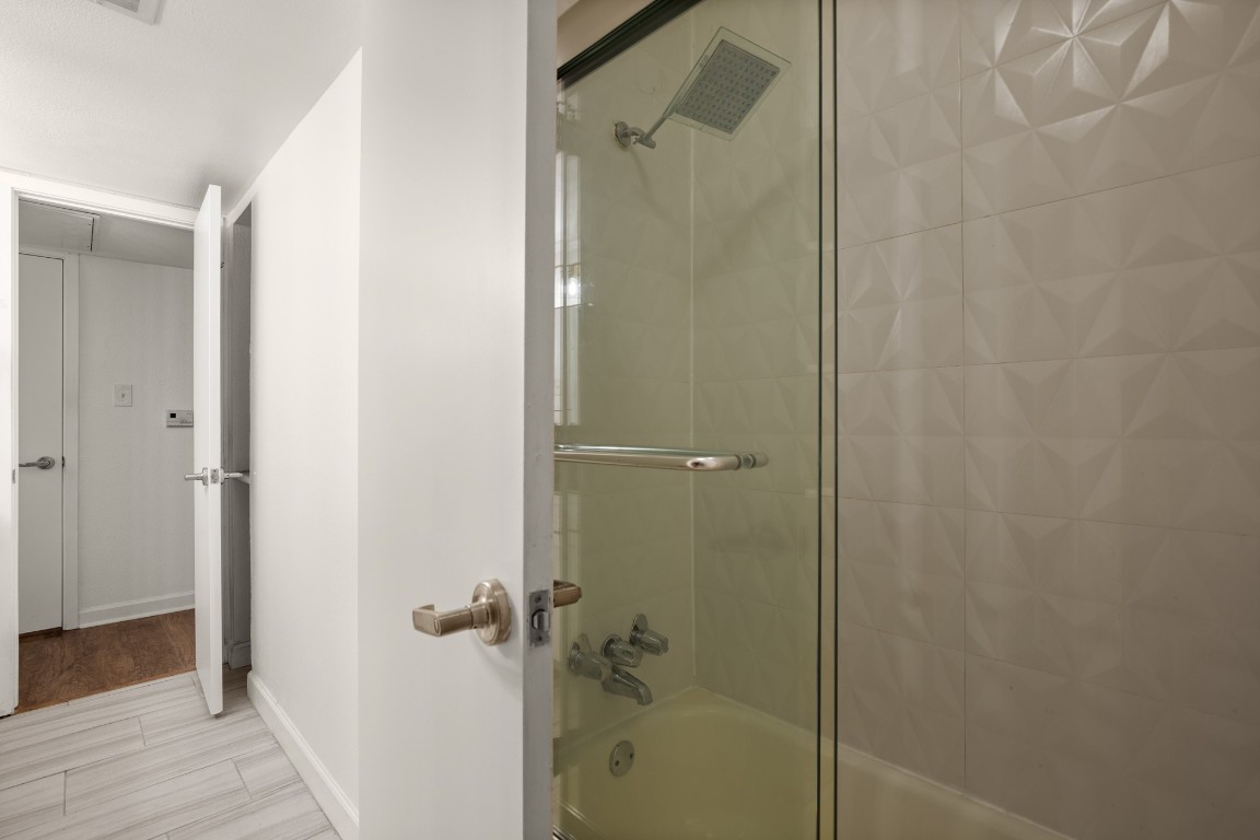 2020 South Congress Avenue, Unit 2102 Austin, TX 78704 - Photo 14 of 22 a bathroom with a shower