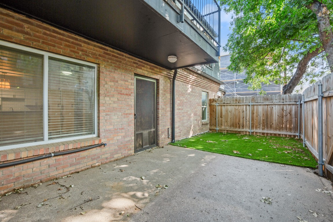 2020 South Congress Avenue, Unit 2102 Austin, TX 78704 - Photo 19 of 22 a view of a backyard with wooden fence