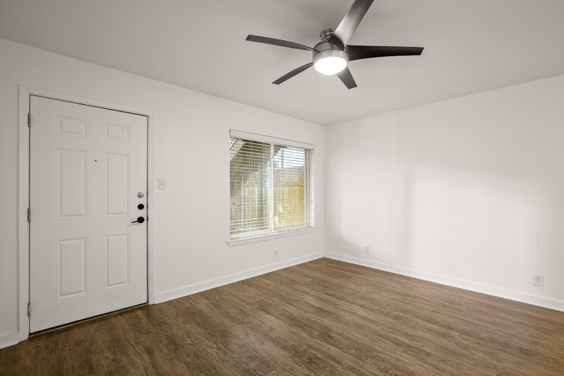 2020 South Congress Avenue, Unit 2102 Austin, TX 78704 - Photo 5 of 22 a view of an empty room with wooden floor and a window