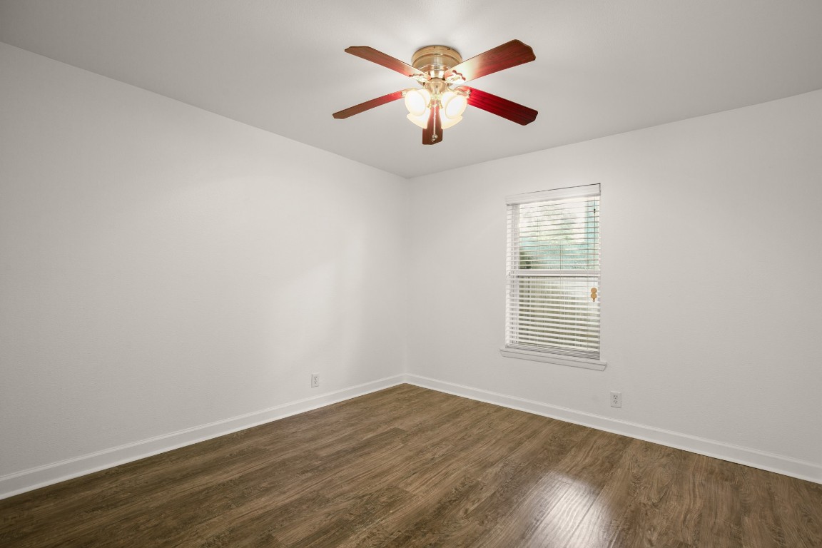 2020 South Congress Avenue, Unit 2102 Austin, TX 78704 - Photo 10 of 22 an empty room with wooden floor and windows