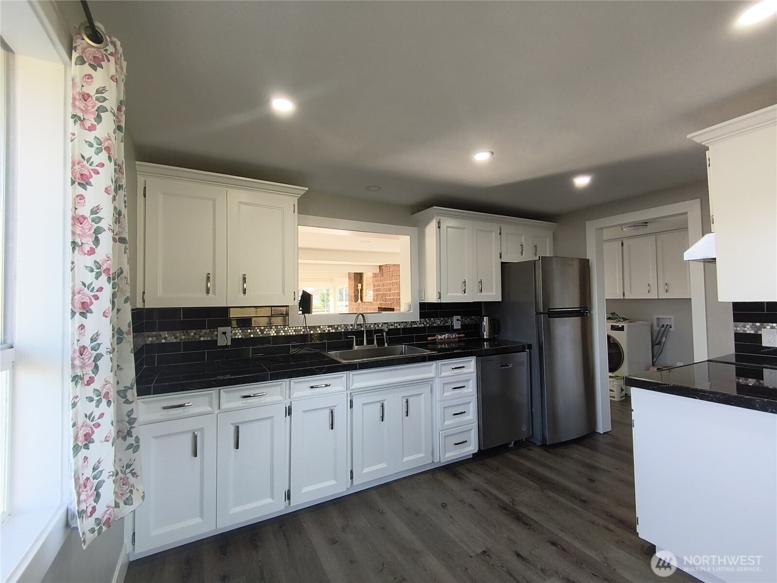 108 West Bartlett Road Lynden, WA 98264 - Photo 11 of 24 a kitchen with stainless steel appliances a refrigerator and a sink
