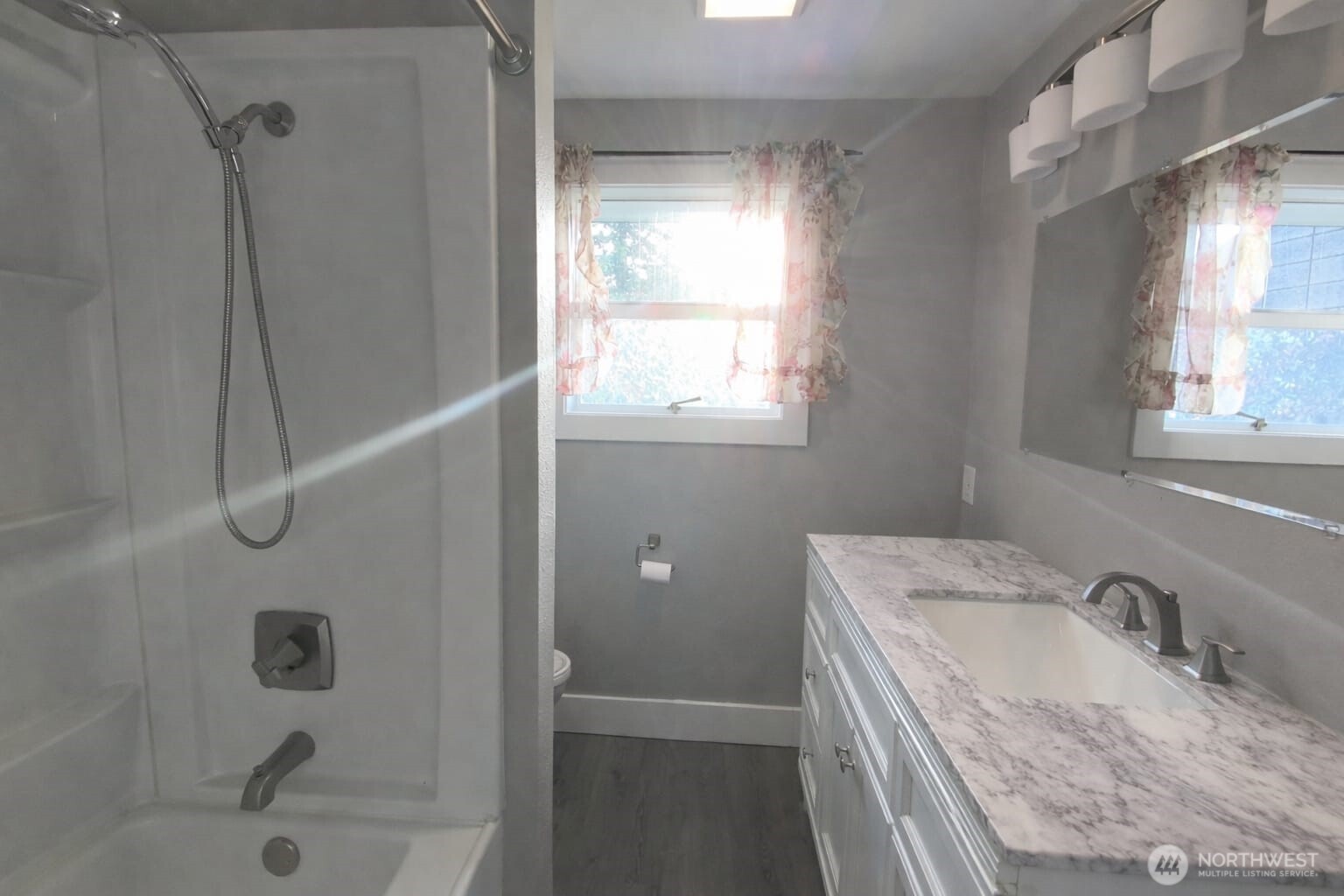 108 West Bartlett Road Lynden, WA 98264 - Photo 13 of 24 a bathroom with a granite countertop sink toilet and shower