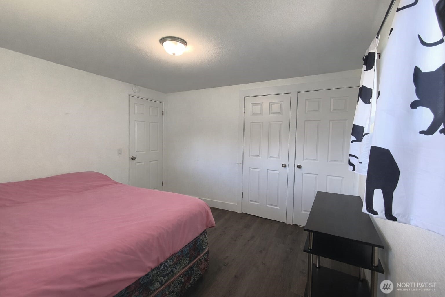 108 West Bartlett Road Lynden, WA 98264 - Photo 14 of 24 a bed room with a bed and a chair