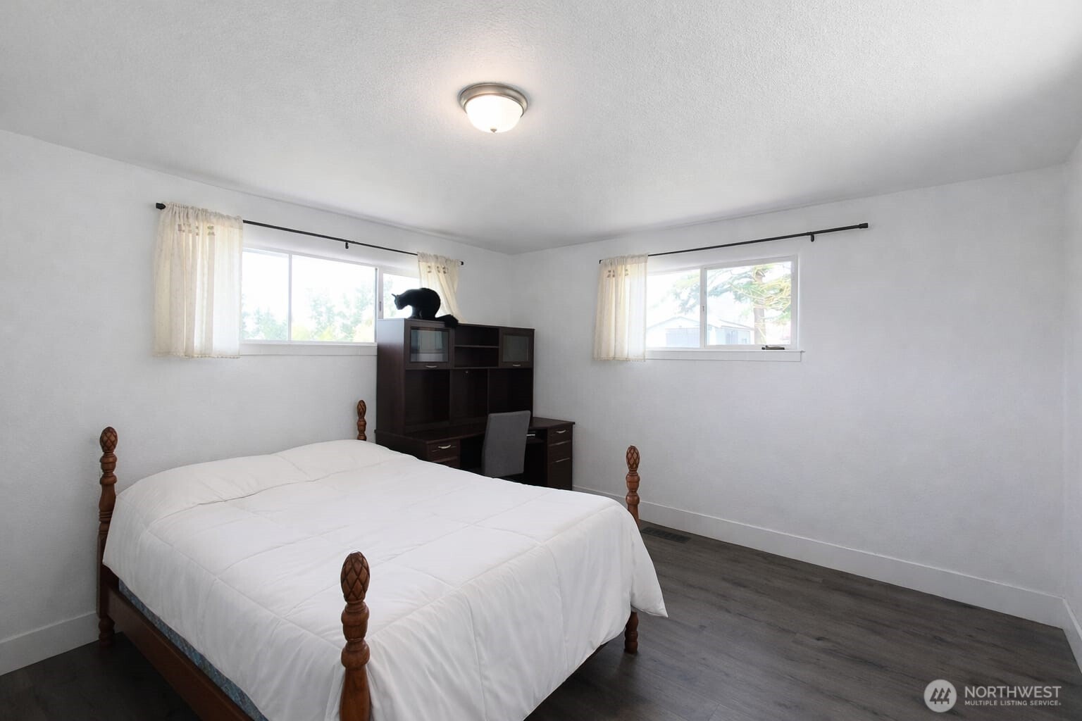 108 West Bartlett Road Lynden, WA 98264 - Photo 19 of 24 a bed sitting in a bedroom next to a window