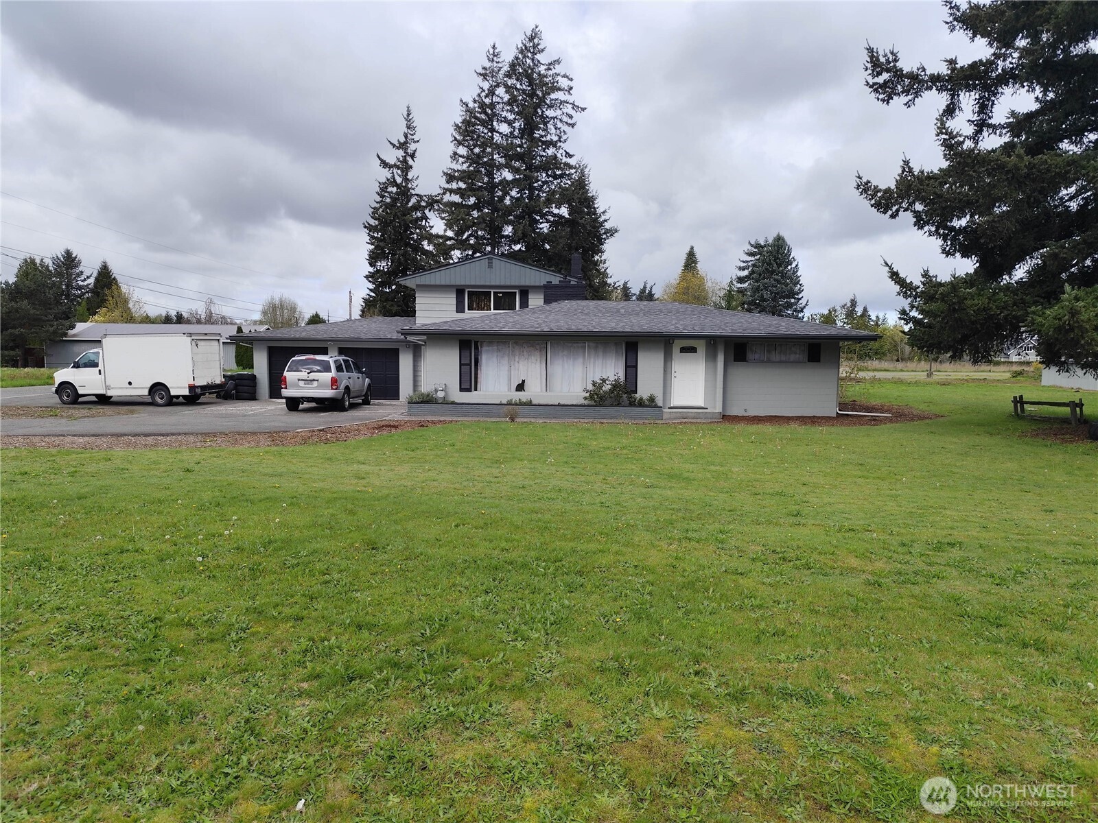 108 West Bartlett Road Lynden, WA 98264 - Photo 2 of 24 a view of a house with a yard and sitting area