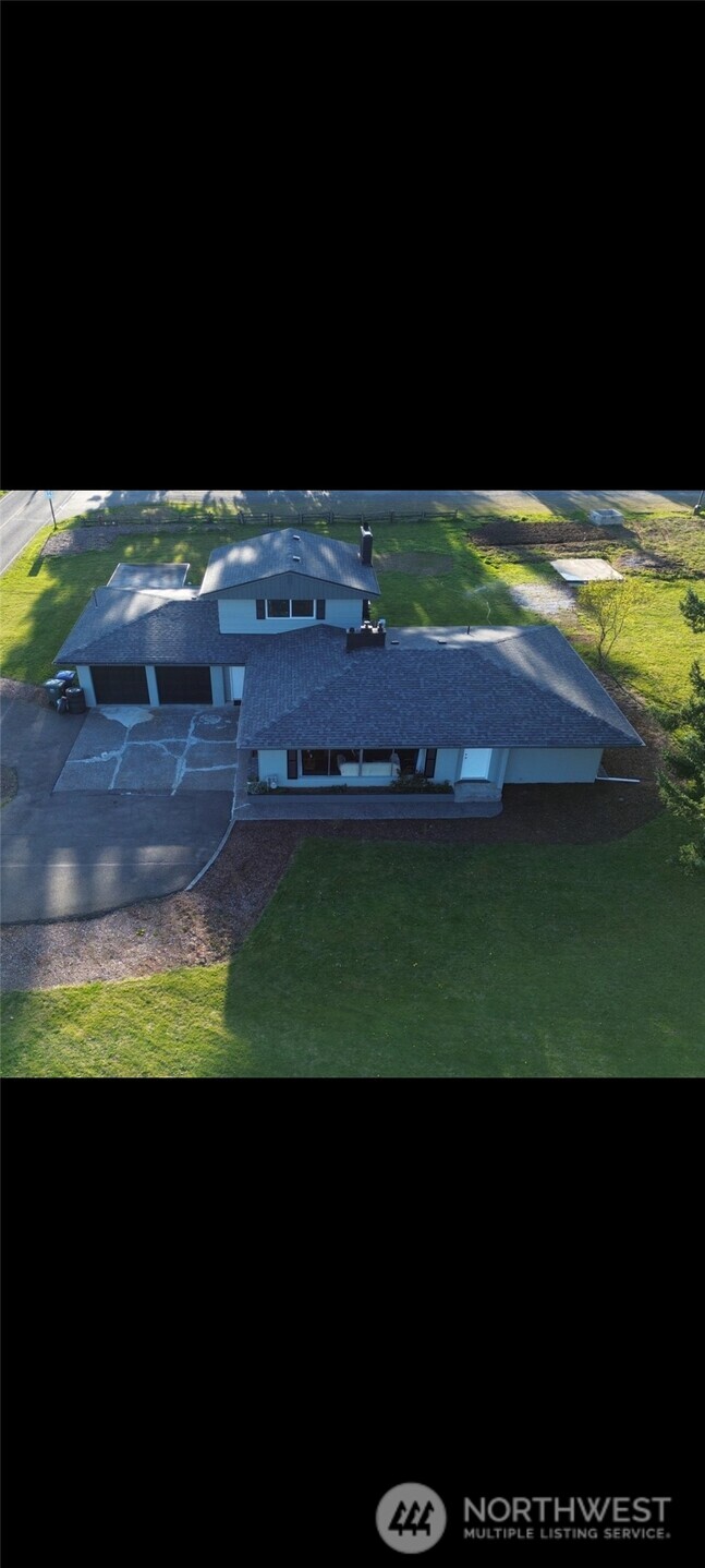108 West Bartlett Road Lynden, WA 98264 - Photo 21 of 24 a view of a back yard of the house