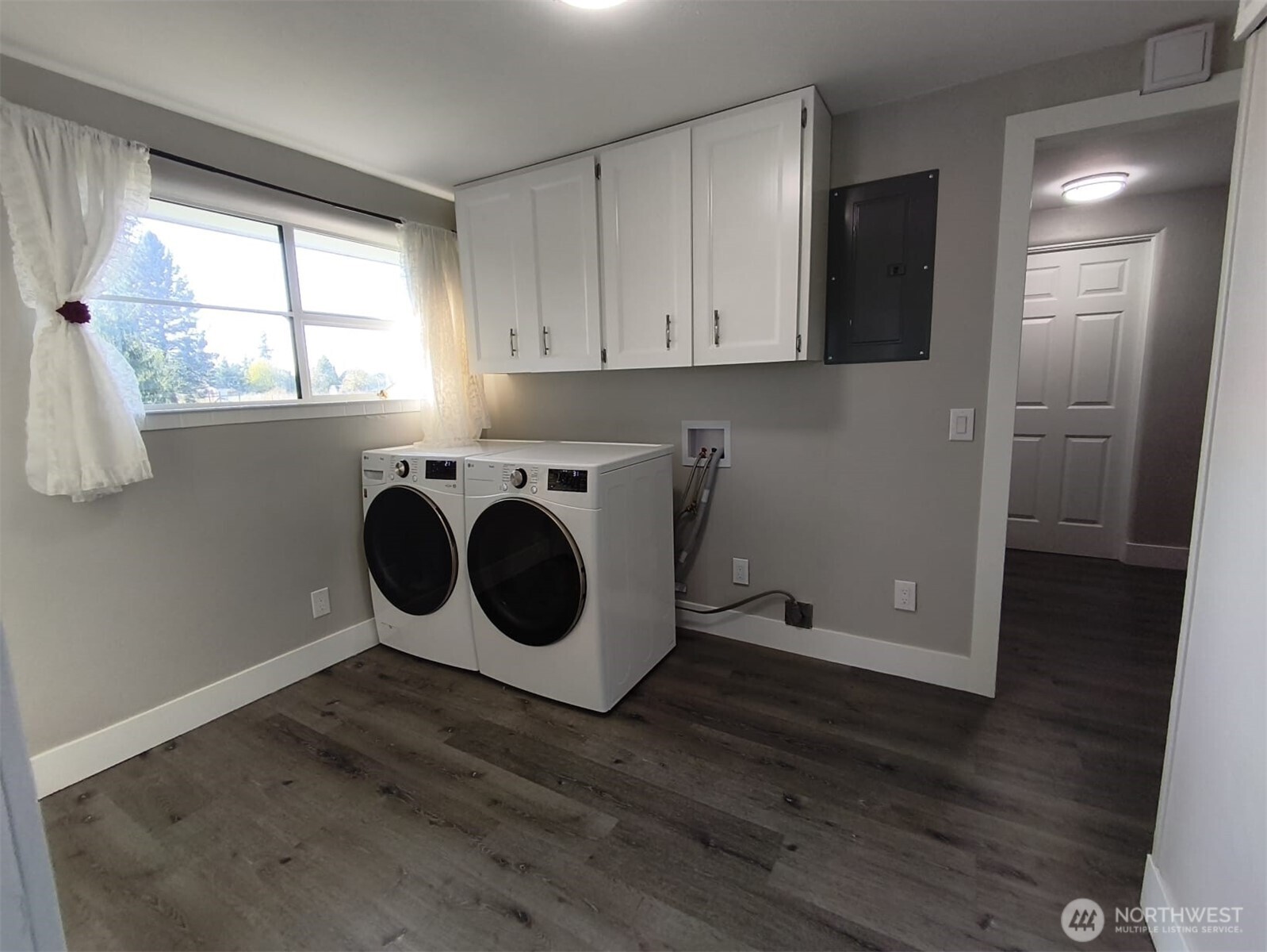 108 West Bartlett Road Lynden, WA 98264 - Photo 7 of 24 a utility room with wooden floor washer and dryer