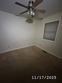 410 South Ralph Street Watseka, IL 60970 - Photo 11 of 18 an empty room with a ceiling fan and a window
