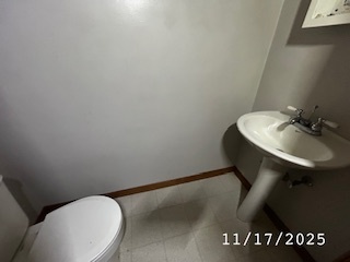 410 South Ralph Street Watseka, IL 60970 - Photo 7 of 18 a bathroom with a sink and a toilet