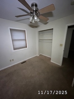 410 South Ralph Street Watseka, IL 60970 - Photo 8 of 18 an empty room with a ceiling fan and window