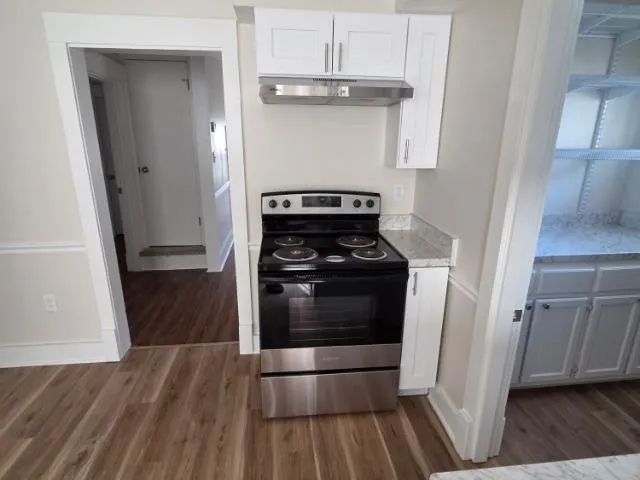 a bathroom with a toilet and a bathtub