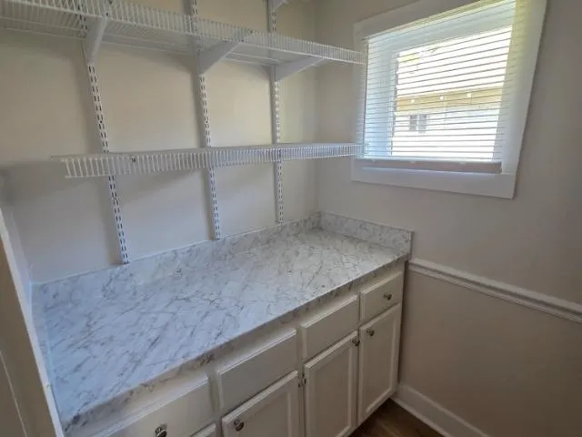 a utility room with cabinets