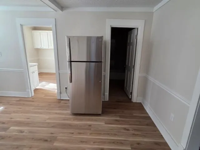 a view of a kitchen from the hallway