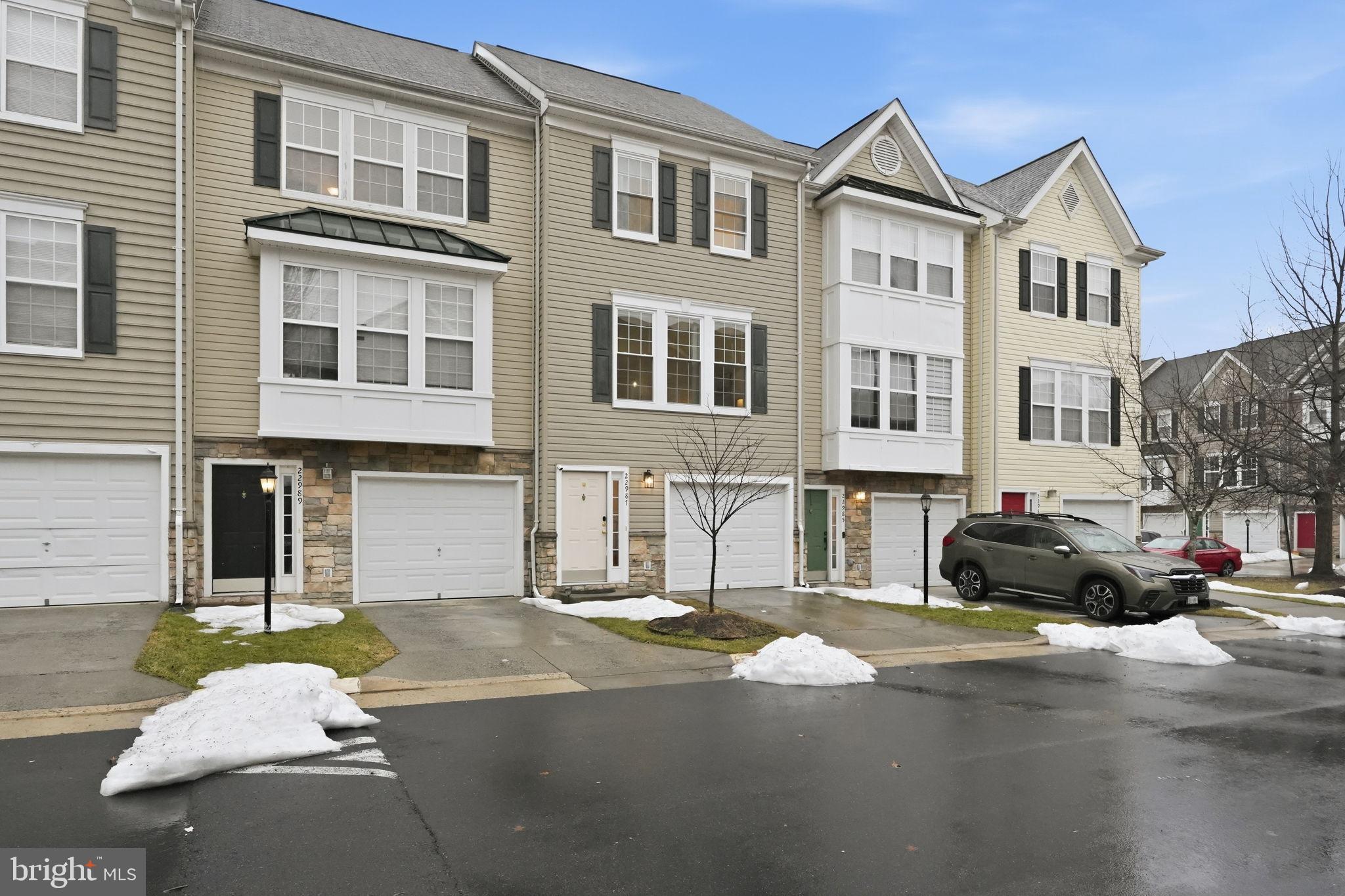 22987 Fontwell Square Sterling, VA 20166 - Photo 1 of 23 Charming townhomes in a winter landscape.