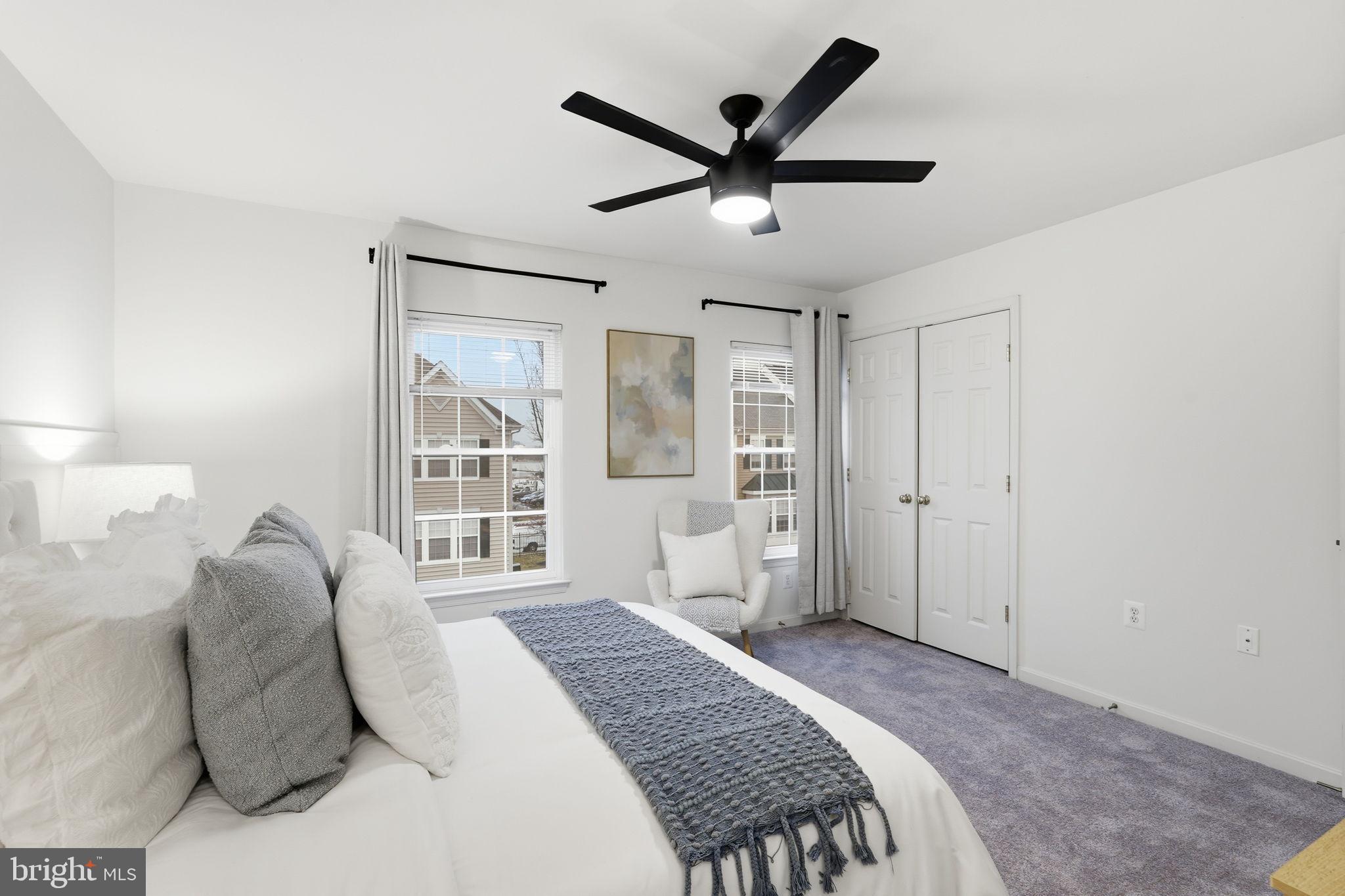 22987 Fontwell Square Sterling, VA 20166 - Photo 14 of 23 Bright and airy bedroom with modern touches.